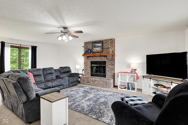 211 Deborah Ln, Whiteland, IN 46184 - living room featuring carpet flooring, ceiling fan, a brick fireplace, and a textured ceiling