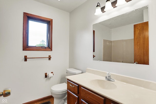 211 Deborah Ln, Whiteland, IN 46184 - full bathroom featuring toilet, vanity, baseboards, and wood finished floors
