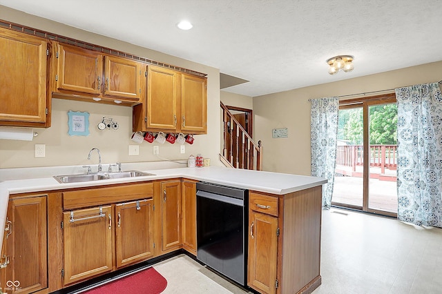211 Deborah Ln, Whiteland, IN 46184 - kitchen with a sink, dishwashing machine, a peninsula, brown cabinetry, and recessed lighting