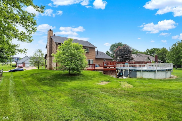 211 Deborah Ln, Whiteland, IN 46184 - view of green lawn featuring a deck and a covered pool