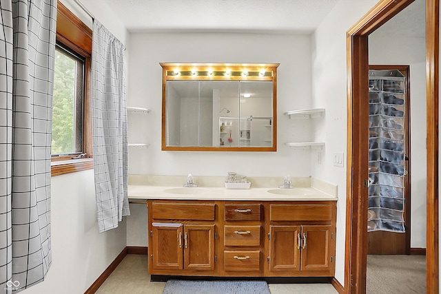 211 Deborah Ln, Whiteland, IN 46184 - bathroom with double vanity and baseboards