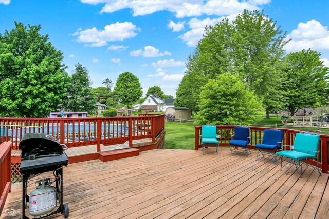 211 Deborah Ln, Whiteland, IN 46184 - wooden deck with a storage shed, an outbuilding, and area for grilling