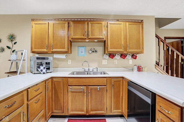 211 Deborah Ln, Whiteland, IN 46184 - kitchen featuring dishwashing machine, a sink, light countertops, and brown cabinets