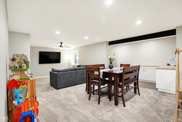 dining space with recessed lighting, light carpet, and ceiling fan