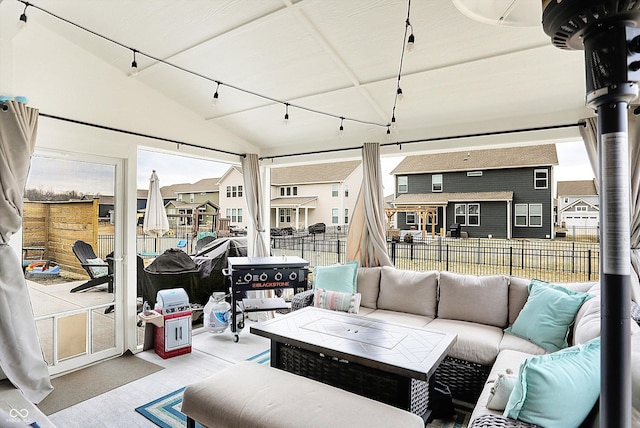 interior space with lofted ceiling and a residential view