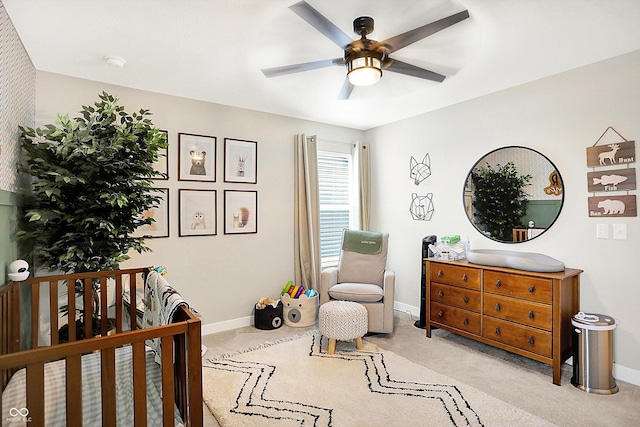 bedroom with carpet, baseboards, and ceiling fan