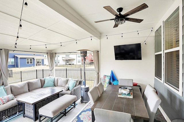 sunroom with a ceiling fan