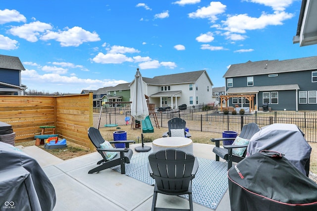 view of patio featuring a residential view, outdoor dining area, and a fenced backyard