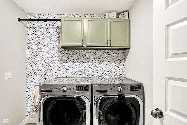 laundry area with cabinet space and independent washer and dryer