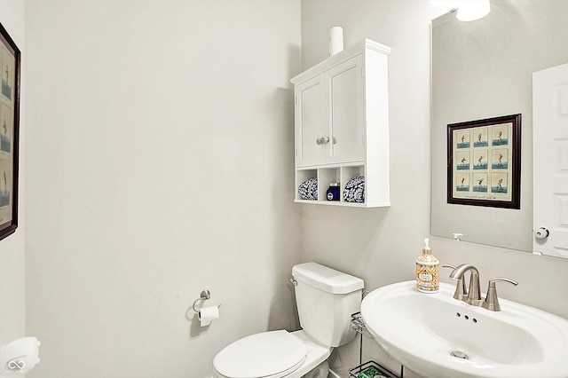 bathroom featuring a sink and toilet