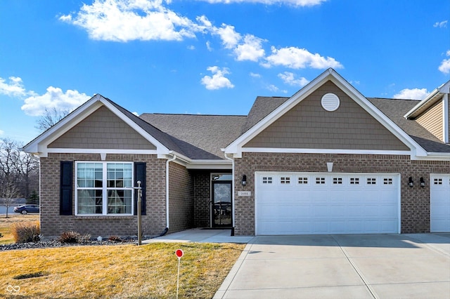 view of front facade featuring driveway, an attached garage, a front lawn, and brick siding