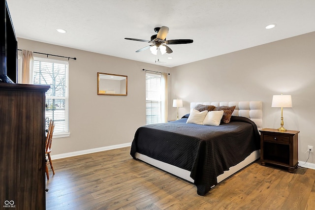 bedroom featuring ceiling fan, baseboards, hardwood / wood-style floors, and recessed lighting