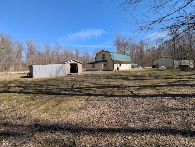 view of yard with an outbuilding and a pole building