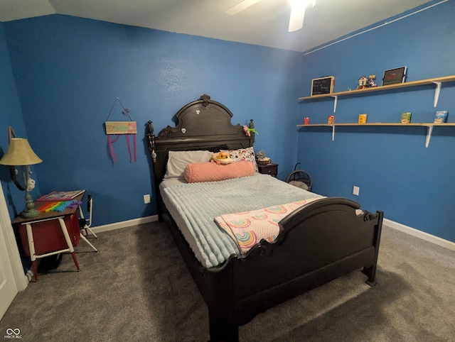 carpeted bedroom with vaulted ceiling, a ceiling fan, and baseboards