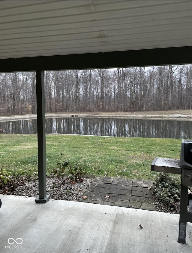 exterior space with a patio area and a water view