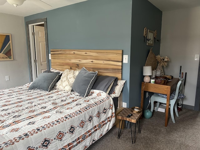 carpeted bedroom with baseboards