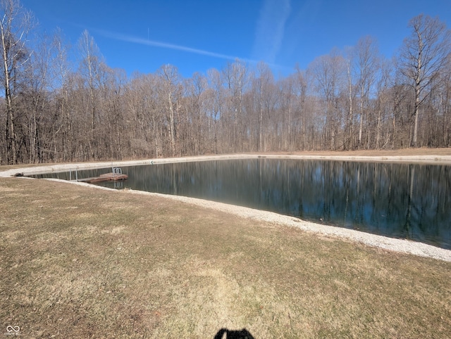 property view of water featuring a wooded view