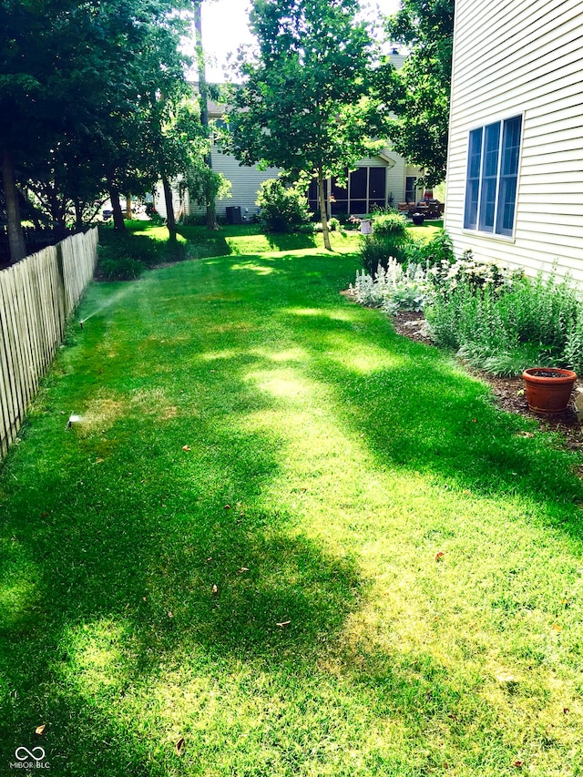 view of yard with fence