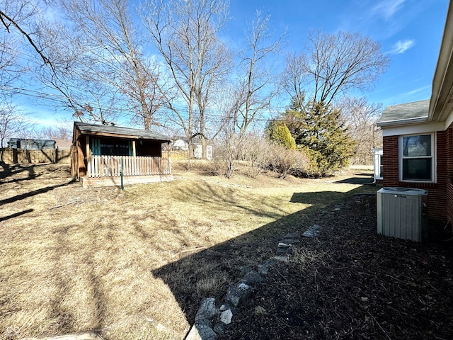 view of yard featuring central air condition unit