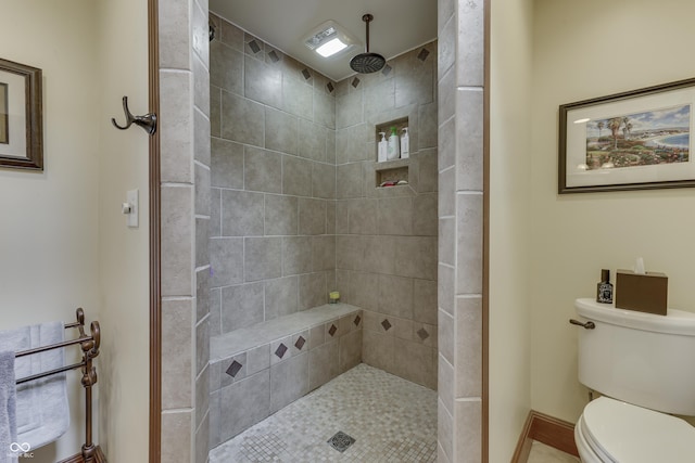 full bathroom with toilet and tiled shower