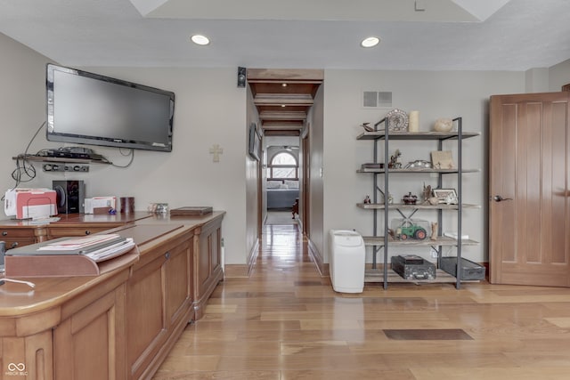 corridor with light wood-type flooring, visible vents, and recessed lighting