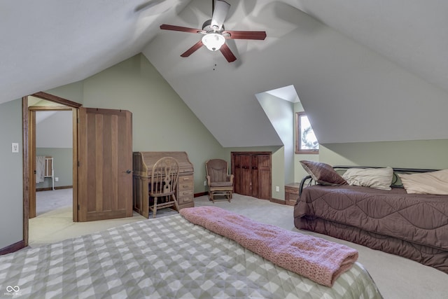 carpeted bedroom featuring lofted ceiling, ceiling fan, and baseboards