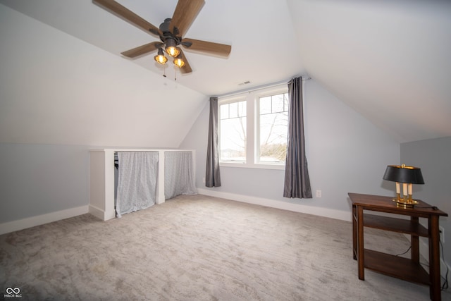 additional living space featuring lofted ceiling, visible vents, and baseboards