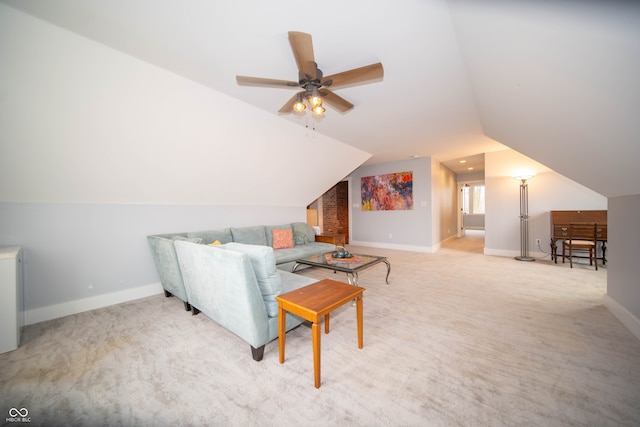 living area with lofted ceiling, ceiling fan, baseboards, and light colored carpet