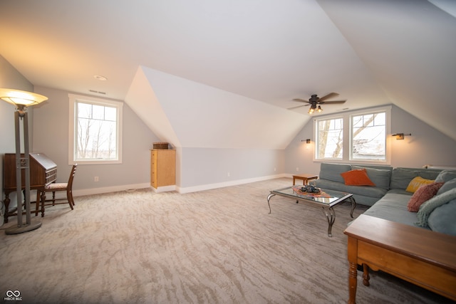 living room featuring lofted ceiling, carpet flooring, visible vents, and baseboards