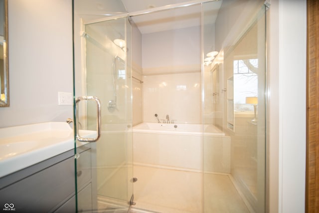 full bathroom featuring a stall shower and vanity