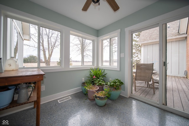 sunroom / solarium with plenty of natural light, visible vents, and a ceiling fan