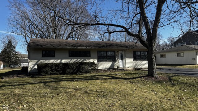 ranch-style house with a front lawn