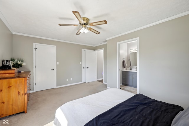 bedroom with light carpet, connected bathroom, baseboards, and ornamental molding