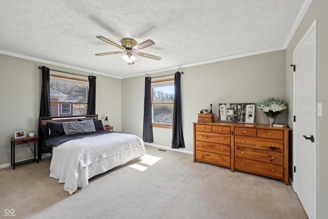 carpeted bedroom featuring a textured ceiling, crown molding, baseboards, and ceiling fan