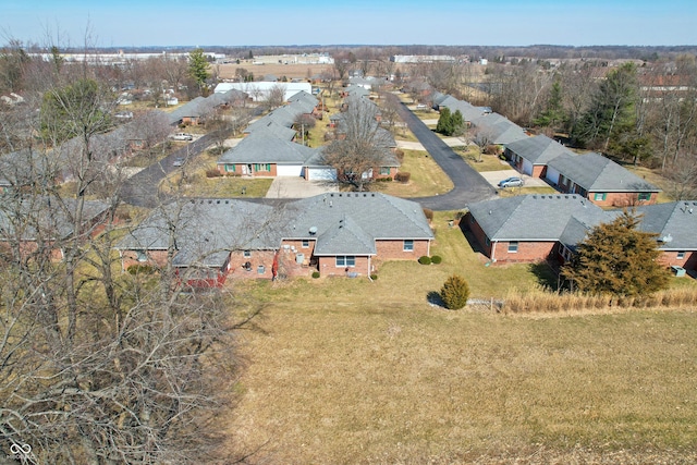 birds eye view of property with a residential view