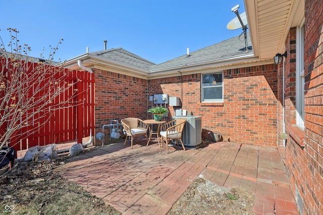 view of patio / terrace with cooling unit and fence