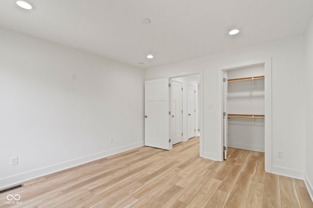 unfurnished bedroom with recessed lighting, visible vents, baseboards, and light wood-style floors