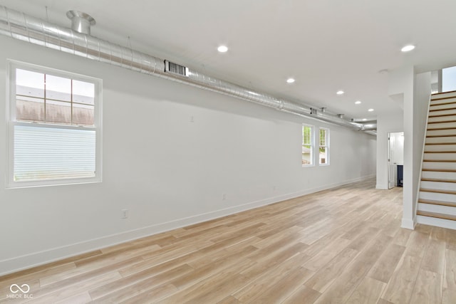 interior space with visible vents, baseboards, stairway, recessed lighting, and light wood-style flooring