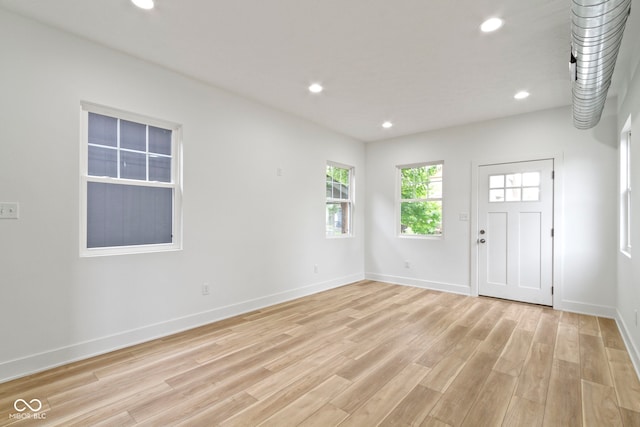 interior space with recessed lighting, baseboards, and light wood-style flooring