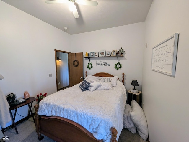 carpeted bedroom featuring a ceiling fan