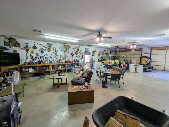 garage with visible vents and a workshop area