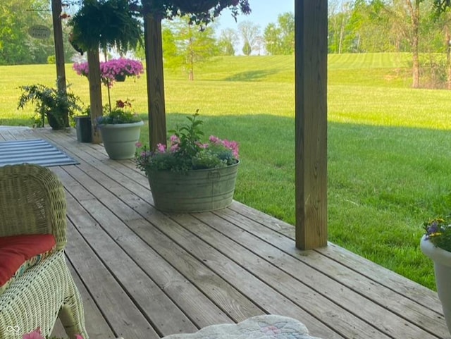 wooden terrace with a yard