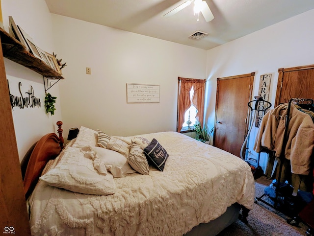 bedroom with ceiling fan and visible vents