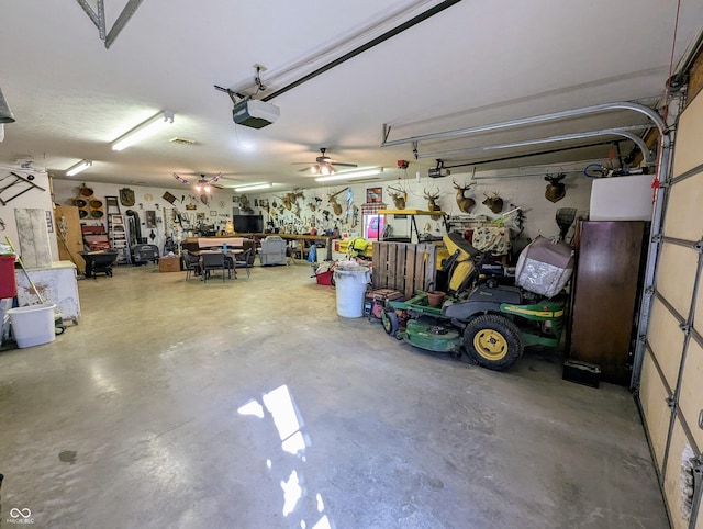 garage featuring a workshop area and a garage door opener