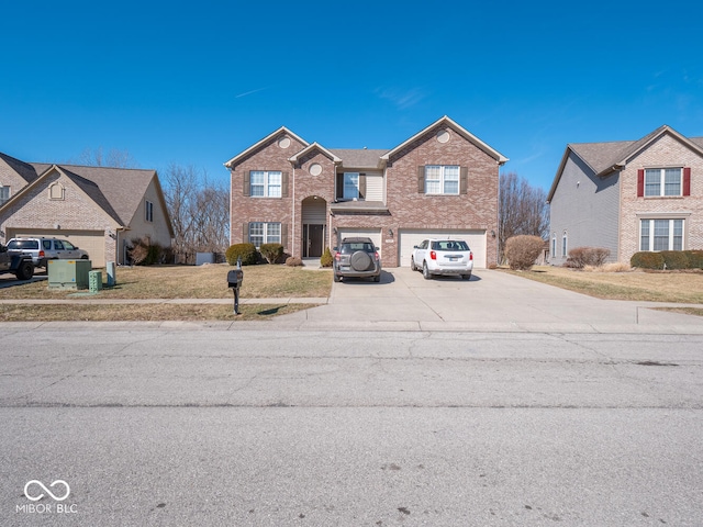 traditional home with a garage, brick siding, driveway, and a front lawn