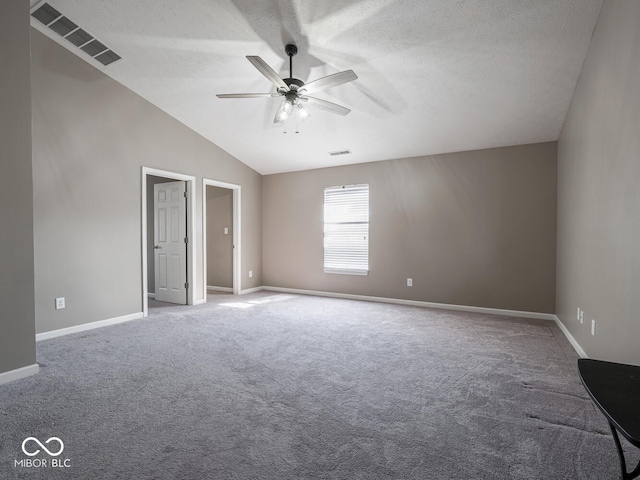 unfurnished bedroom featuring lofted ceiling, visible vents, a textured ceiling, and baseboards