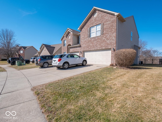 view of home's exterior with a garage, a yard, concrete driveway, and brick siding