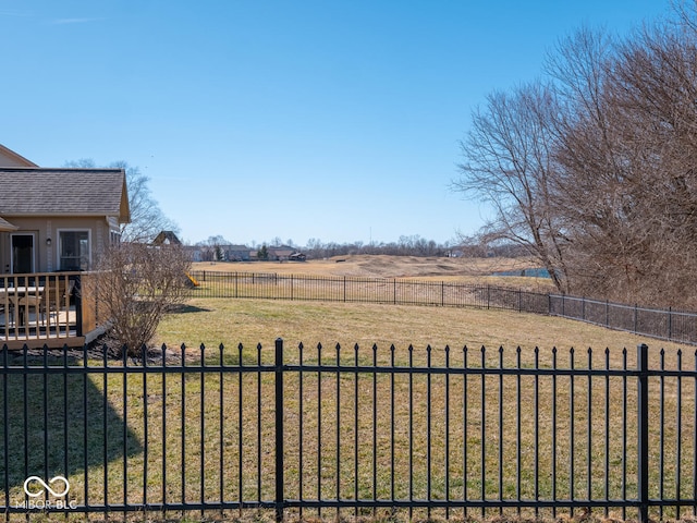 view of yard featuring a rural view and fence