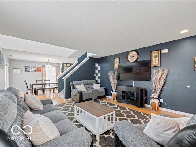 living room featuring baseboards and wood finished floors