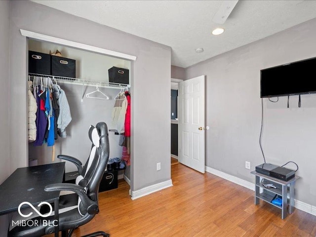 office space featuring wood finished floors and baseboards